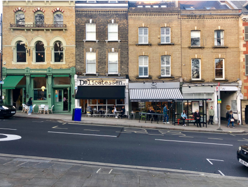 Photo of a street lined with commercial properties.